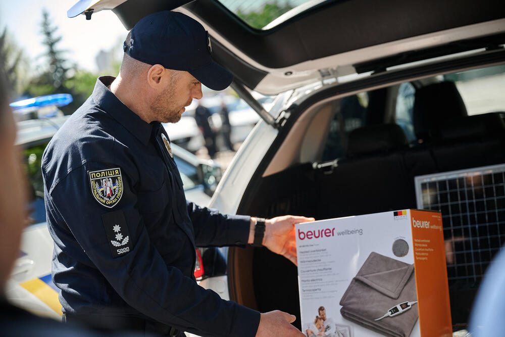 Police officer showcases equipment for GBV response used by specialized police units and mobile teams