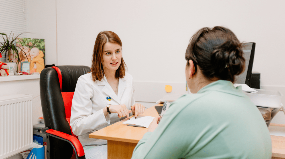 UNFPA-supported maternity hospital's specialist with a patient